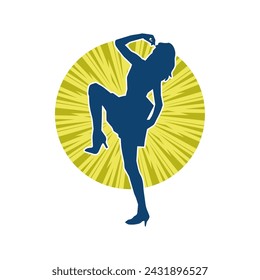 Silhouette of a female dancer in action pose. Silhouette of a slim woman in dancing pose.