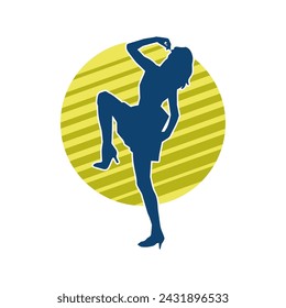 Silhouette of a female dancer in action pose. Silhouette of a slim woman in dancing pose.