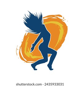 Silhouette of a female dancer in action pose. Silhouette of a slim woman in dancing pose.