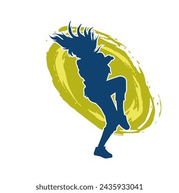 Silhouette of a female dancer in action pose. Silhouette of a slim woman in dancing pose.