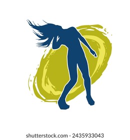 Silhouette of a female dancer in action pose. Silhouette of a slim woman in dancing pose.