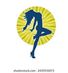 Silhouette of a female dancer in action pose. Silhouette of a slim woman in dancing pose.