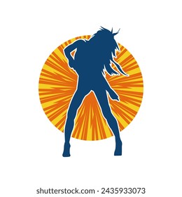 Silhouette of a female dancer in action pose. Silhouette of a slim woman in dancing pose.