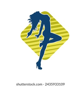 Silhouette of a female dancer in action pose. Silhouette of a slim woman in dancing pose.