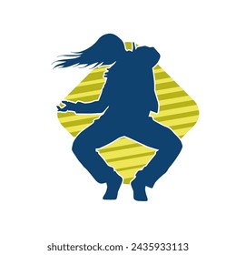 Silhouette of a female dancer in action pose. Silhouette of a slim woman in dancing pose.