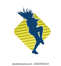 Silhouette of a female dancer in action pose. Silhouette of a slim woman in dancing pose.