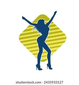 Silhouette of a female dancer in action pose. Silhouette of a slim woman in dancing pose.