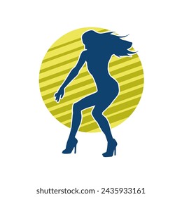 Silhouette of a female dancer in action pose. Silhouette of a slim woman in dancing pose.