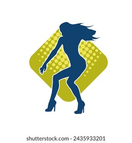 Silhouette of a female dancer in action pose. Silhouette of a slim woman in dancing pose.