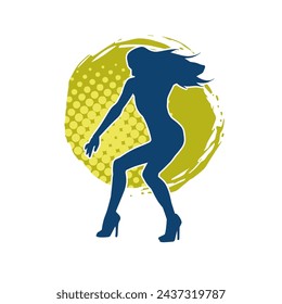 Silhouette of a female dancer in action pose. Silhouette of a slim woman in dancing pose.