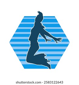 Silhouette of a female dancer in action pose. Silhouette of a slim woman in dancing pose.