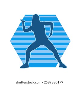 Silhouette of a female dancer in action pose. Silhouette of a slim woman in dancing pose.