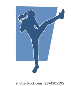 Silhouette of a female martial art person doing kicking pose. Silhouette of a woman doing martial art pose.