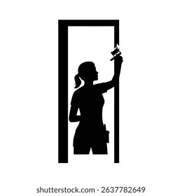 Silhouette of Female Painter Detailing Window Trim - Home Renovation