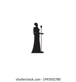 Silhouette of female singer with her microphone