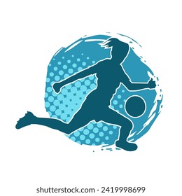 Silhouette of a female soccer player kicking a ball. Silhouette of a football player woman in action pose.