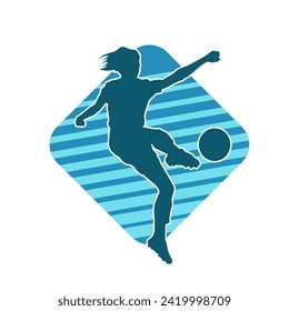 Silhouette of a female soccer player kicking a ball. Silhouette of a football player woman in action pose.