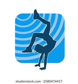 Silhouette of a female teenage girl dancing and doing handstand pose 