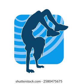 Silhouette of a female teenage girl dancing and doing handstand pose 