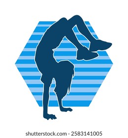 Silhouette of a female teenage girl dancing and doing handstand pose 