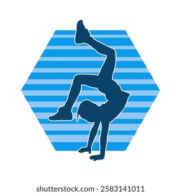 Silhouette of a female teenage girl dancing and doing handstand pose 