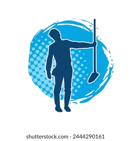 Silhouette of a female wearing worker costume in action pose with shovel tool.