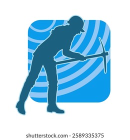 Silhouette of a female wearing worker costume in pose with pick axe tool. Silhouette of a woman in miner costume carrying pick axe tool.