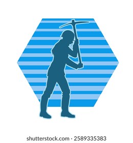 Silhouette of a female wearing worker costume in pose with pick axe tool. Silhouette of a woman in miner costume carrying pick axe tool.