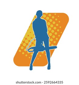 Silhouette of a female worker in action pose carrying chainsaw machine tool. Silhouette of a woman wearing worker costume and carrying chainsaw machine