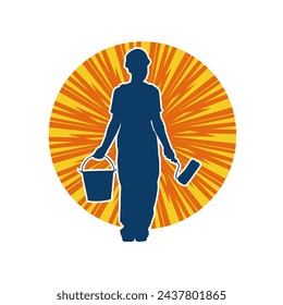 Silhouette of a female worker doing painting work. Silhouette of an interior painter worker.
