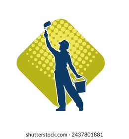 Silhouette of a female worker doing painting work. Silhouette of an interior painter worker.
