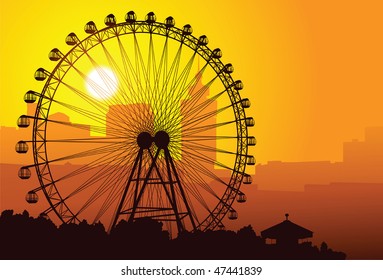 Silhouette Of A Ferris Wheel At Sunset