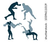 silhouette of fighters on a arena. greco-roman, freestyle, collegiate, scholastic, amateur wrestling or MMA