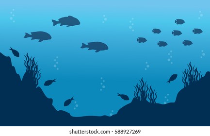 Silhouette of fish on blue ocean landscape