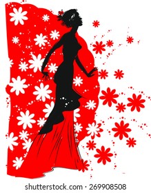 Silhouette of flamenco dancer with a fan