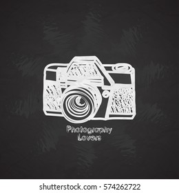 Silhouette flat vector icon with digital mini camera. Photography art. Megapixel photocamera. Cartoon style. Illustration, element for your design. Photographic lens. Simple. Monochrome. Creativity