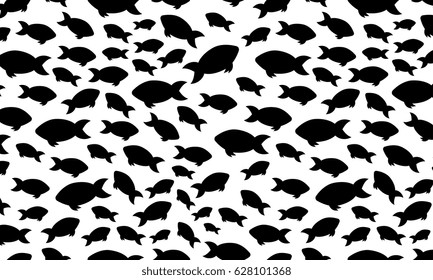 Silhouette flock of fish swimming in the water