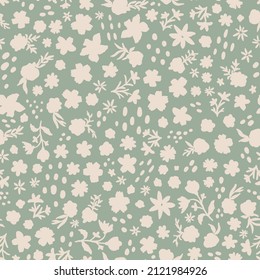 Silhouette flowers with leaves and dots all over print on sage green background.