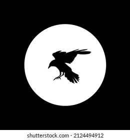 Silhouette of a flying crow on a black background. To create a logo. Vector illustration 