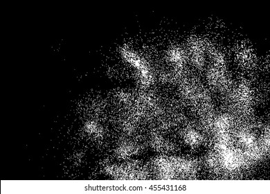 Silhouette of food flakes such as salt or almond or wheat flour spread on the flat surface or table. Top view of dust, sand blow or bread crumbs. Abstract grainy texture isolated on black background.
