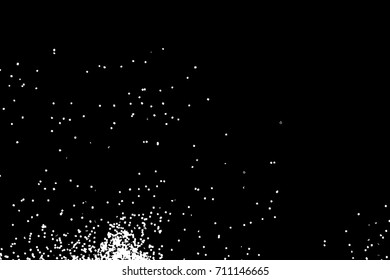 Silhouette of food flakes such as salt or almond or wheat flour spread on the flat surface or table. Abstract grainy texture isolated on black background. Top view of dust, sand blow or bread crumbs. 