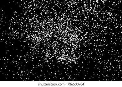 Silhouette of food flakes such as salt or almond or wheat flour spread on the flat surface or table. Abstract grainy texture isolated on black background. Top view of dust, sand blow or bread crumbs. 