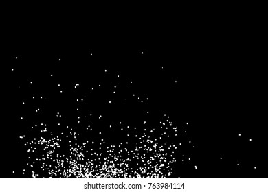 Silhouette of food flakes such as salt or almond or wheat flour spread on the flat surface or table. Abstract grainy texture isolated on black background. Top view of dust, sand blow or bread crumbs. 