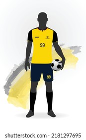 Silhouette of a football soccer player standing and holding a ball. Wearing Ecuador jersey kit.