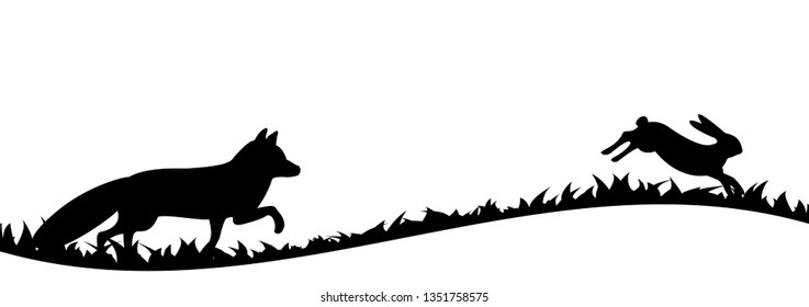 Silhouette of fox and hare in the grass.