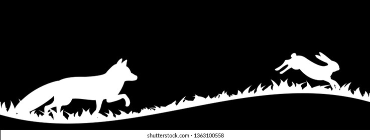 Silhouette of fox and hare in the grass.