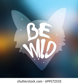 Silhouette of fox with lettering text Be Wild on blur background. Vector label.