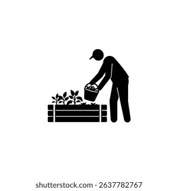 Silhouette of Gardener Harvesting from Raised Bed - Urban Farm