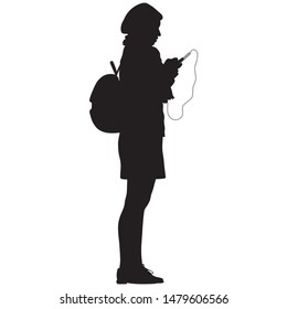 silhouette of girl with backpack and phone