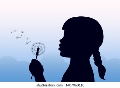 silhouette of a girl with pigtail blowing on a dandelion on a light blue sky background
